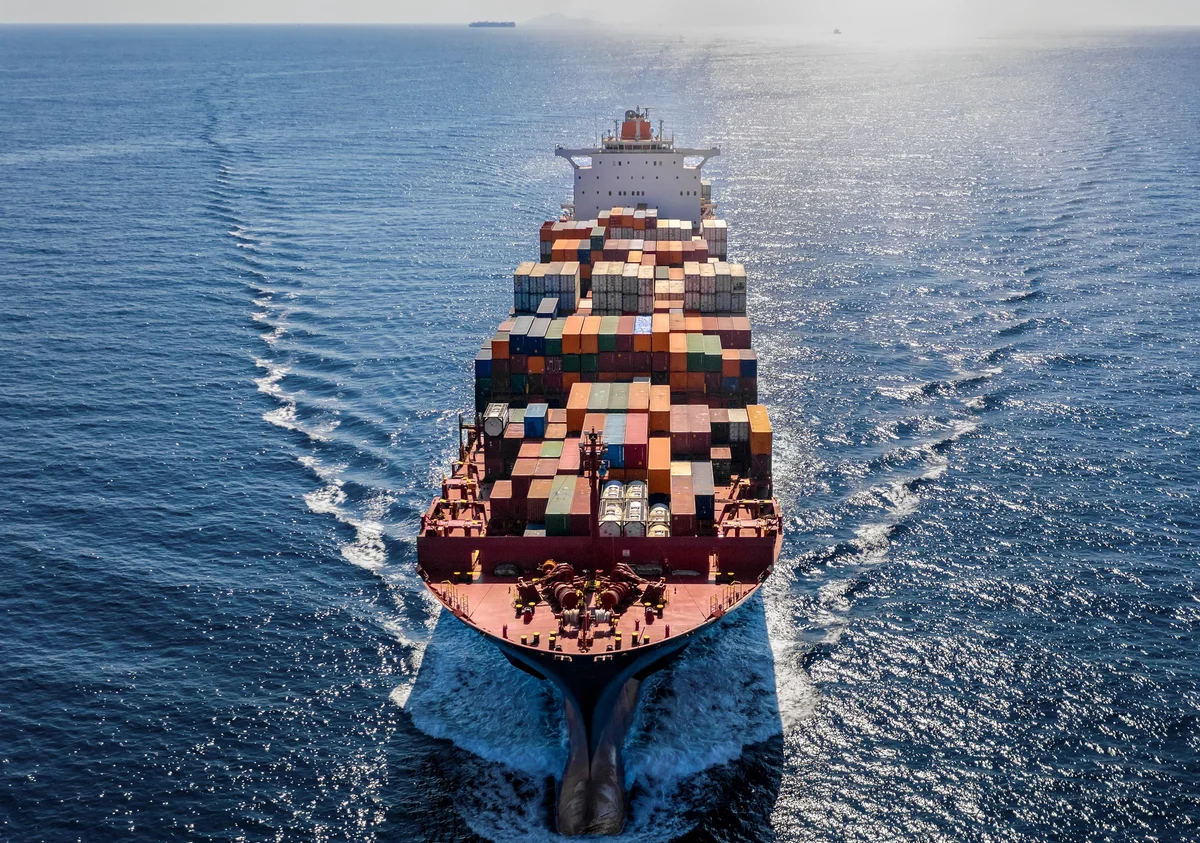 Aerial view of freighter at sea towards